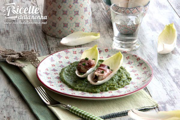 Bocconcini di rana pescatrice con speck, indivia belga e zucchine