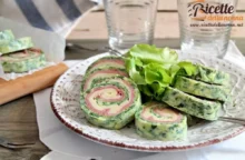 Prendi come base una frittata di spinaci e aggiungi provola e prosciutto cotto. Cosa ottieni? Un rotolo di frittata gustoso e saporito